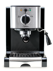 Front facing view of black espresso machine with silver panel featuring power button and brew/steam dial.  Steamer/frother sits on the right side of the machine. 