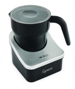 Front left facing view of black milk pitcher with clear plastic lid sitting on the silver milk frother base featuring three buttons for cold froth, hot froth, and warm froth.