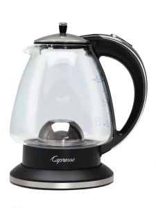 Front facing view of glass hot water kettle, empty,  with polished chrome lid and handle accents. 