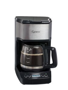 Front facing view of five cup mini drip coffee maker with glass five cup carafe. Base of machine features a digital clock and buttons for programming and power button.
